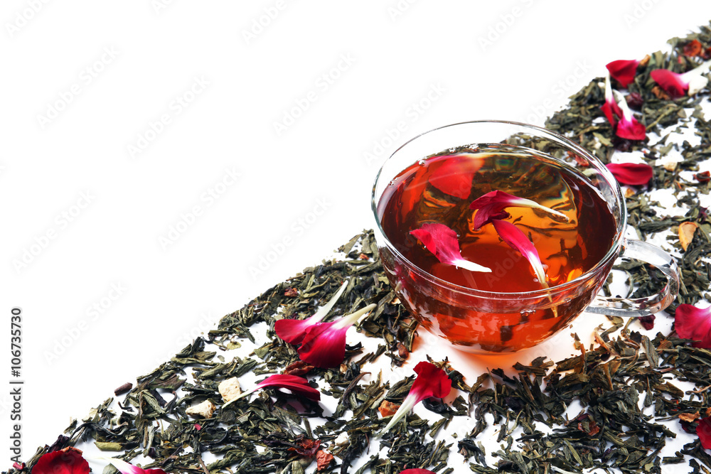 Cup of tea with dry leaves isolated on white