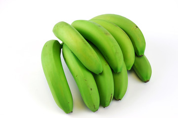 green bananas on white background