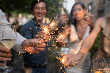 Haooy people at celebration holding glowing sparklers