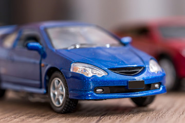 two toy cars on desk