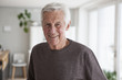 © Westend61 - Portrait of smiling senior man at home