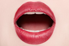 Close-up Of Open Mouth Woman With Beautiful Red Lips