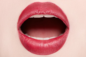 close-up of open mouth woman with beautiful red lips