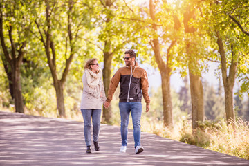 Couple in love  in autumn nature on a walk