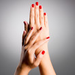 © Valua Vitaly - Closeup photo of a female hands with red nails