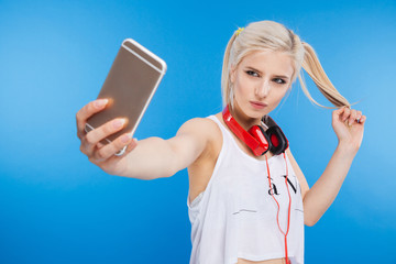 Wall Mural - Female teenager making selfie photo