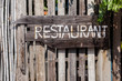 Wooden handmade sign restaurant on vintage plate