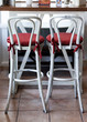 White vintage chairs with red pillow in cafe