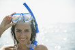 © JGI/Jamie Grill/Blend Images - Caucasian woman wearing snorkel and mask in ocean