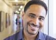 © Sam Diephuis/Blend Images - Black businessman smiling in office hallway