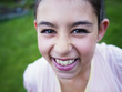 © Donald Iain Smith/Blend Images - Close up of mixed race girl laughing