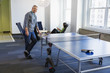© Don Mason/Blend Images - Businessman standing at table tennis table in office