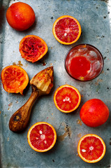 Wall Mural - the fresh bloody oranges cut in half on a vintage metal tray.