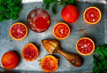 Wall Mural - the fresh bloody oranges cut in half on a vintage metal tray.