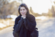 © Marc Romanelli/Blend Images - Older Hispanic woman crouching outdoors
