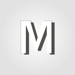 Wall Mural - capital letter m on a grey background