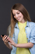 © stas_80 - Young beautiful girl reads a text message on a cell phone