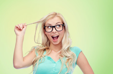 Wall Mural - happy young woman or teenage girl in glasses