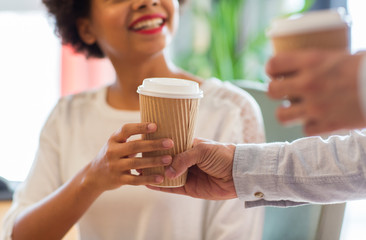 Canvas Print - close up of happy woman hand taking coffee cup