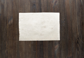 paper on wooden background