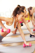 © Kalim - Group of women working out in gym