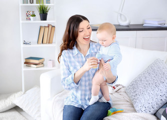 Wall Mural - Happy woman with baby boy, closeup