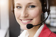 © Connect Images - Close up of young businesswoman using telephone headset