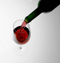 Pouring Red Wine Into Glass
