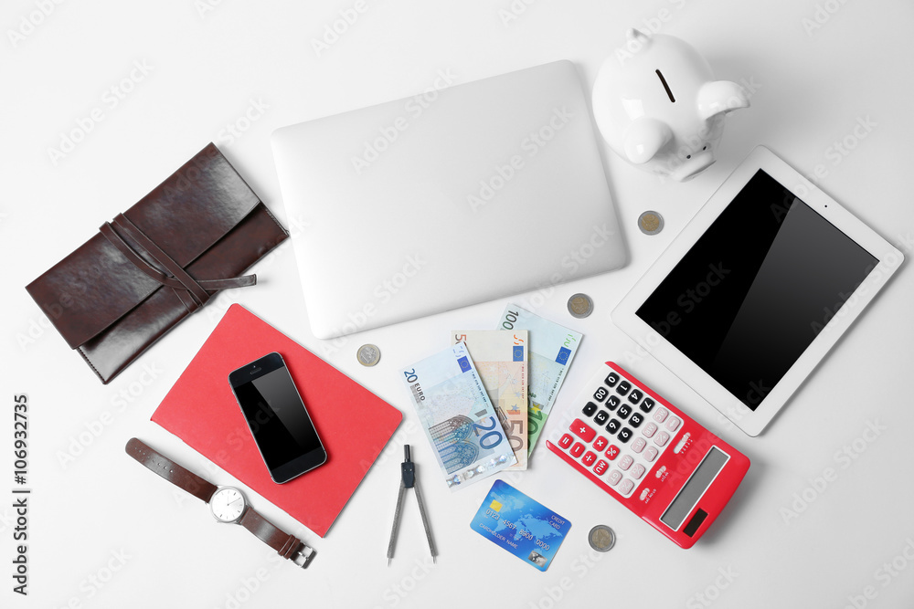 Business concept. Gadgets and money on office table, top view
