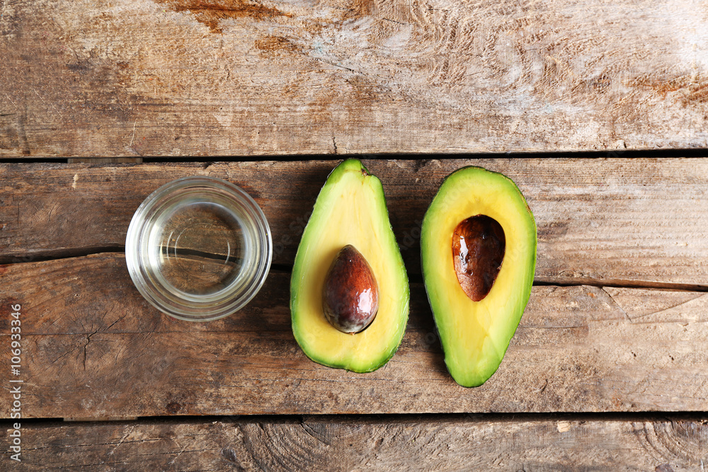 Fresh avocados  on wooden table, top view