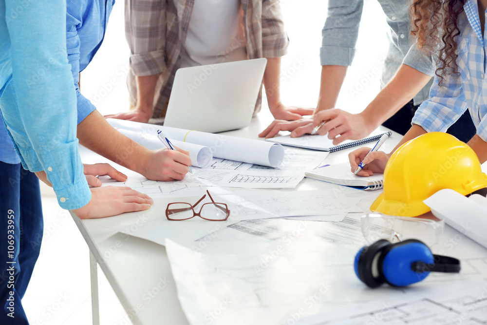 Professional engineers working with blueprints Stock Photo | Adobe Stock