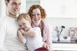 © Connect Images - Portrait of mid adult couple and four year old son