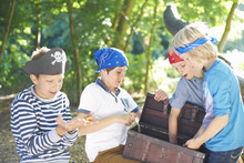 Young Boys Dressed As Pirates With Treasure Chest
