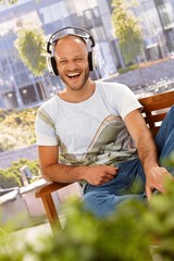 Poster - Happy man enjoying music outdoors