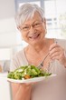 © nyul - Happy old woman eating green salad