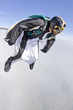 © Connect Images - Mid adult man free falling in wingsuit preparing to fly
