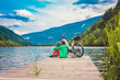 woman with e-bike resting beside a beautiful lake-e-power 20