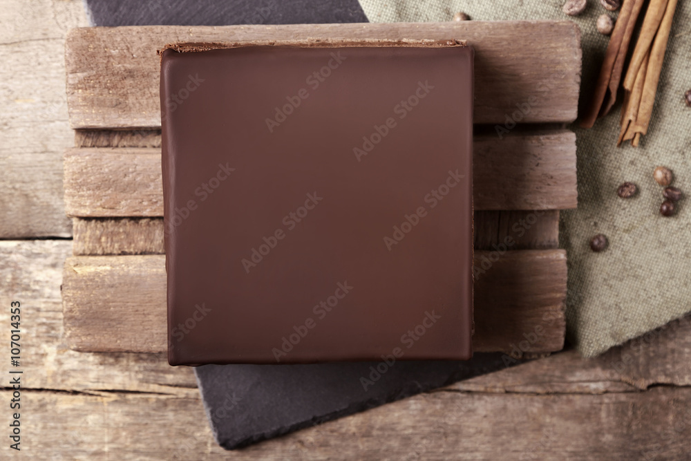 Delicious chocolate cake on cutting board, top view