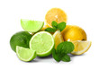 Ripe lime and lemon with slices and green leaves isolated on white