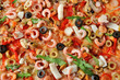 © Africa Studio - Pizza with seafood, red pepper and olives, close up