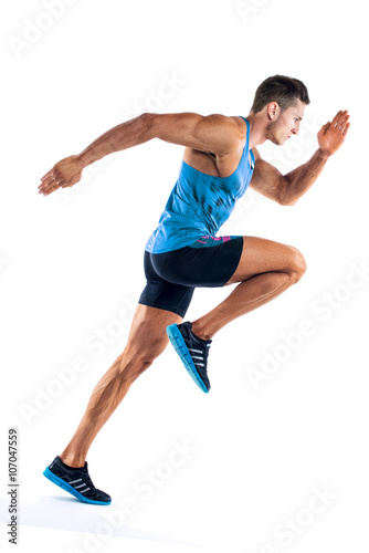 Fotografía Full length portrait of a fitness man running isolated on a white background