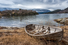 Old Boat On The Shore By A Norwegian Fjord