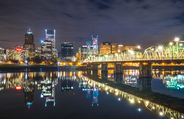 Wall Mural - water with reflection and cityscape and skyline of portland at n