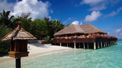 Wall Mural - Maldives, the bar on the beach, blue sky with spring clouds