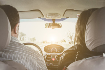 view from behind of a couple in the car