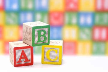 Wall Mural - ABC blocks on a colorful blurred background