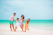 © travnikovstudio - Happy young family on beach vacation