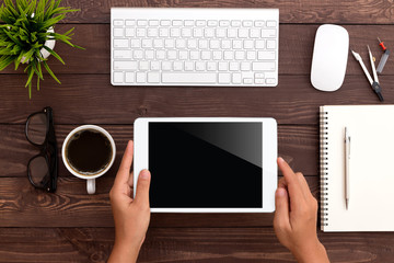 Poster - hand using white tablet on workspace