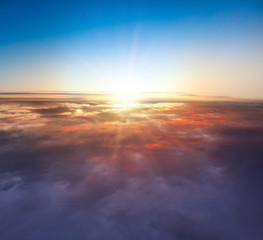 Wall Mural - Beautiful sunset above clouds