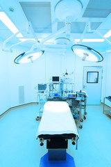 Wall Mural - equipment and medical devices in modern operating room take with art lighting and blue filter